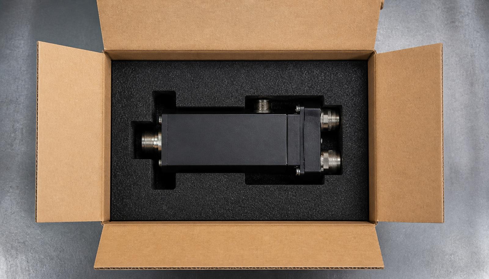 Custom 5 ply corrugated box with black die cut foam insert holding an industrial electronic component