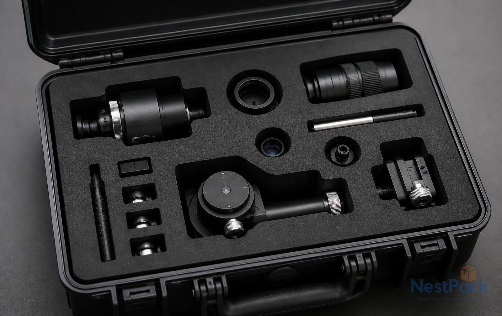 CNC-cut EVA foam insert with instrument cavities inside a hard case